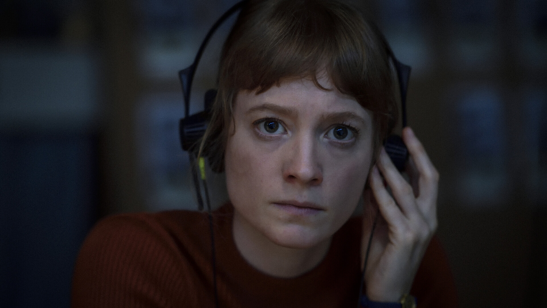 close up of a woman wearing headphones