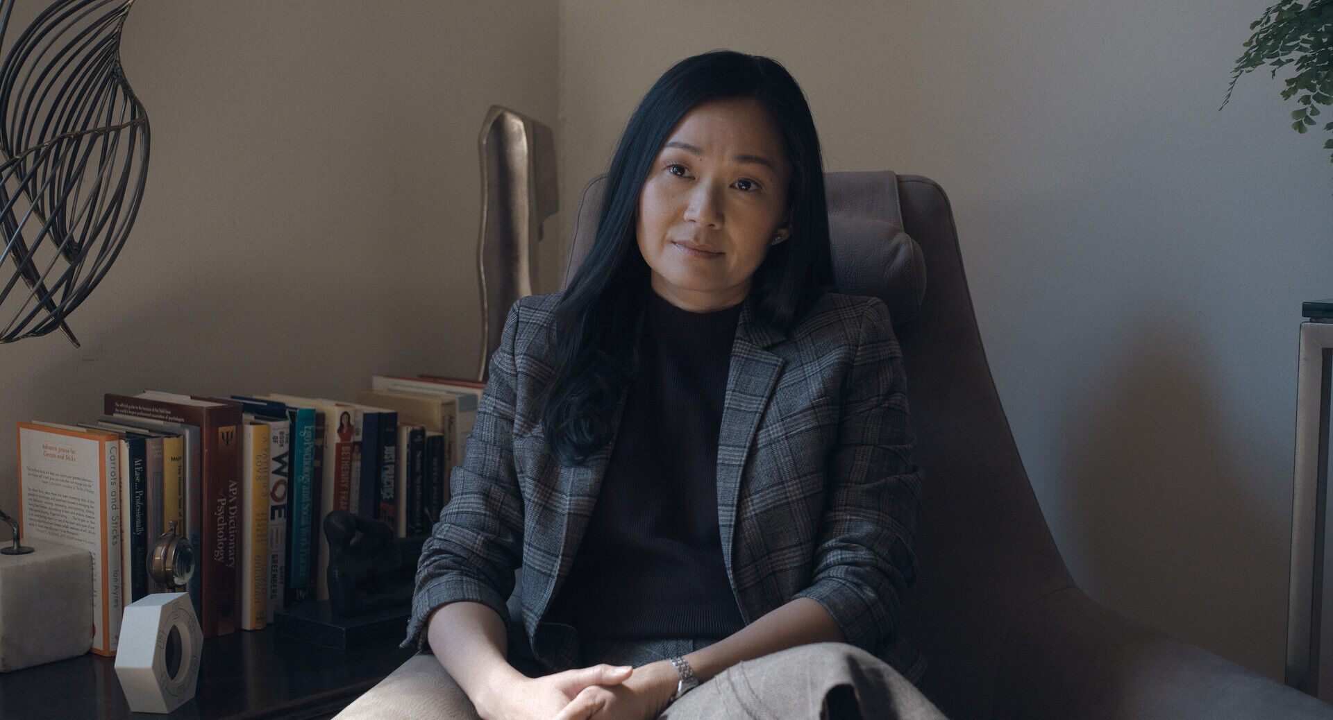 Hong Chau on set in psychiatrist office